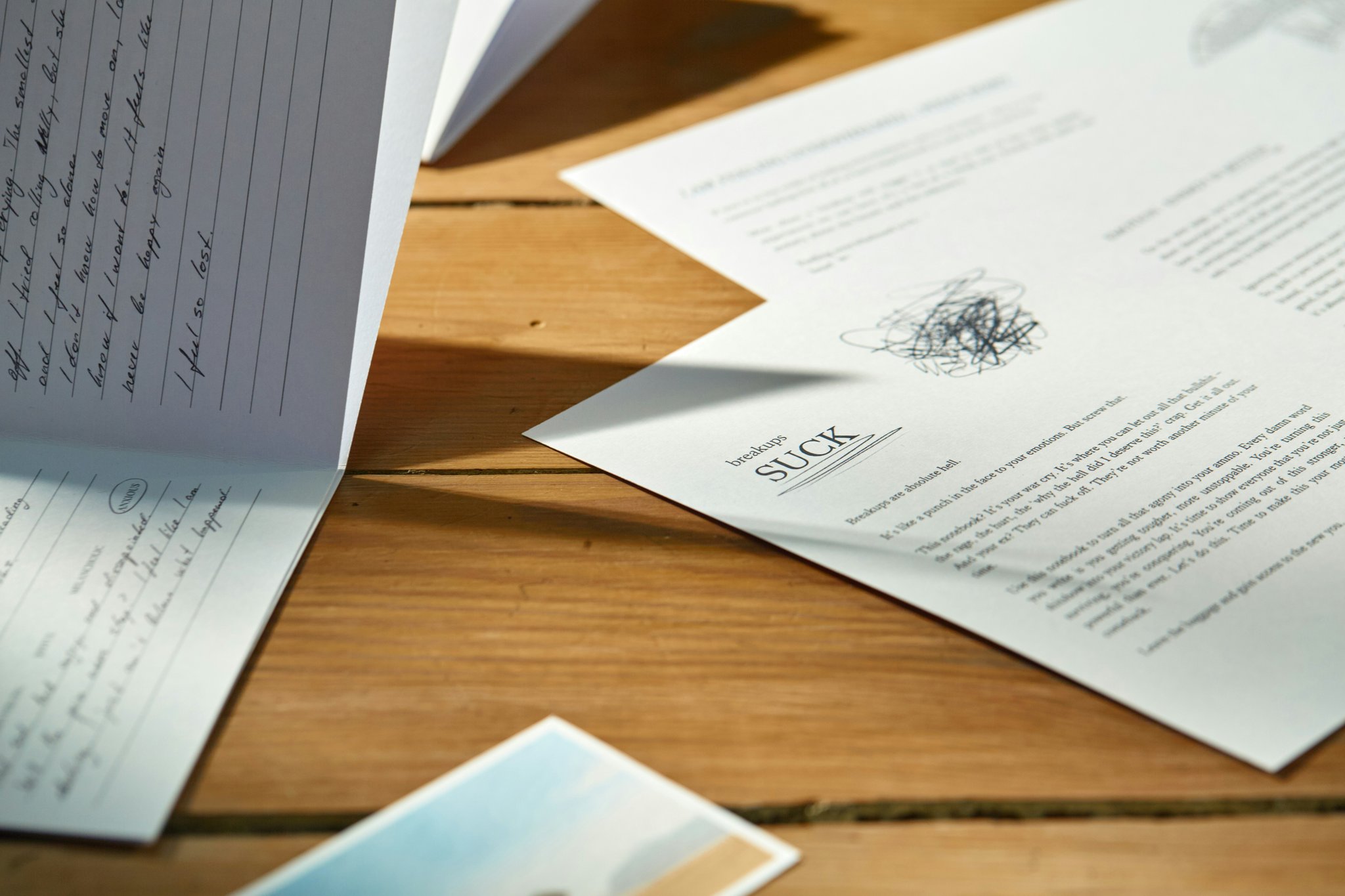 A desk covered with documents and a magnifying glass, representing thorough documentation practices.